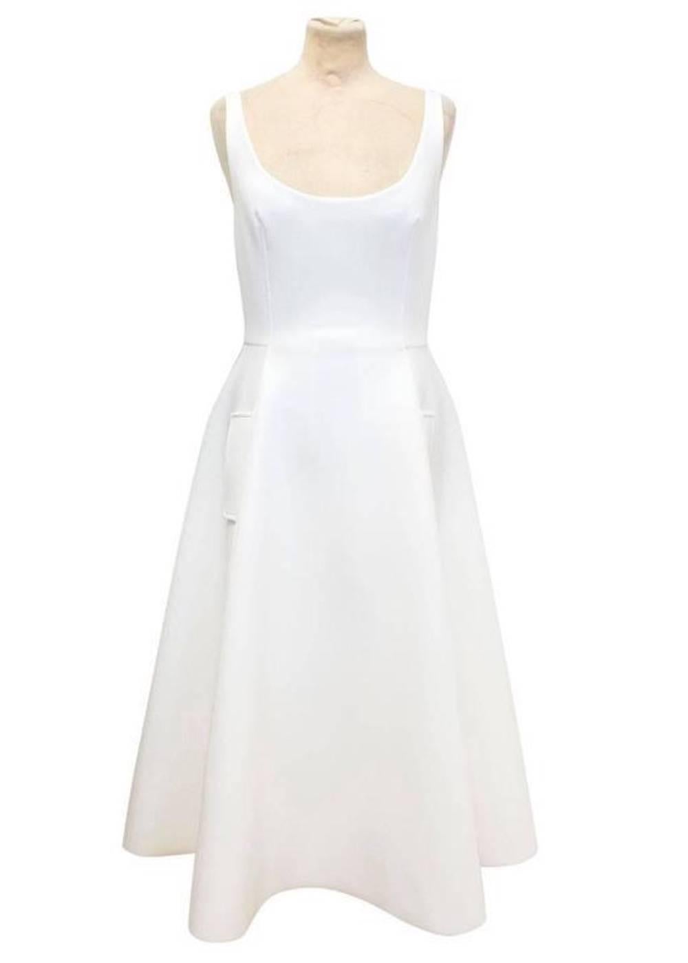 Lanvin white neoprene textured tea length sleeveless dress. features a scoop neckline, flared skirt, two side welt pockets on the skirt and fastens at the back with a concealed zip. 

Approx measurements.
Shoulders: 34cm
Chest: 41cm
Waist: