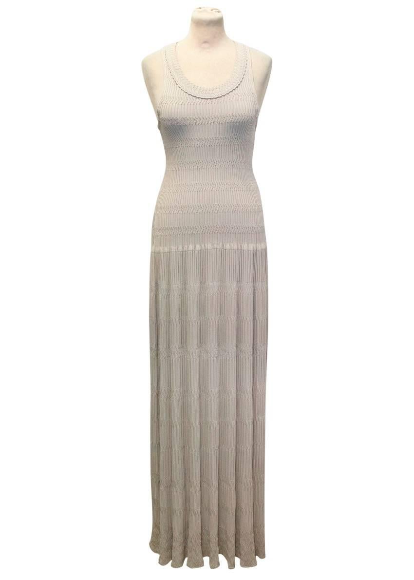 Alaia beige Ondine viscose knit sleeveless maxi dress. Features a scoop neckline, dropped flared skirt and ribbed details. 

This item has been worn once and is in excellent condition.

Condition: 9.5/10

Size IT: 38
Size UK: 6
Size US: