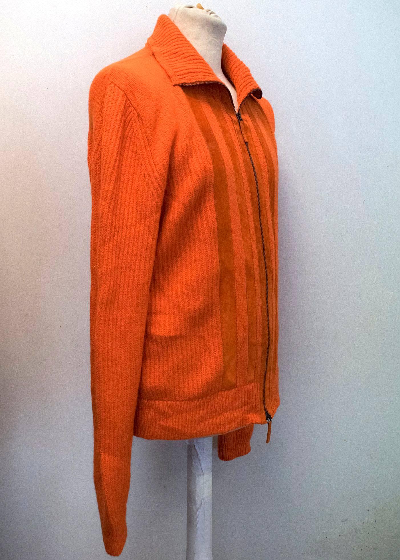 Bottega Veneta orange cashmere and leather cardigan with a zip up front. 
Leather panels either side of the zip and a high neck collar. 

Condition 10/10

Size EU: 48
Size UK: 38

Measurements Approx:
Length -69cm 
Shoulder - 46cm
Sleeves -79cm 