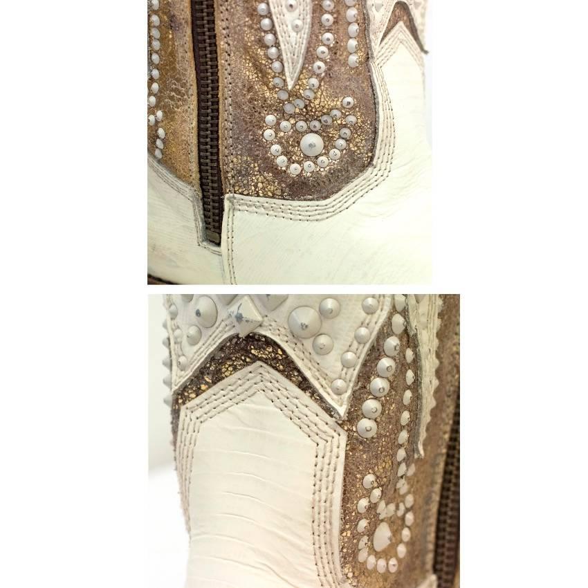 Frye tall cream cowboy boots. Features, stud details, genuine good year welt, metallic gold upper, bronze tone exposed side zips, an almond toe and a a stacked heel. 

There are minor storage marks to the upper leather please refer to images,