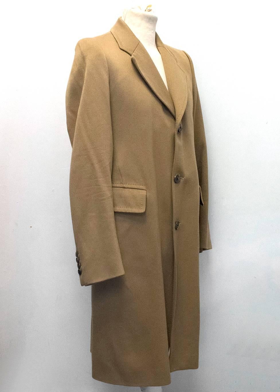 Dries Van Noten camel single breasted coat with 3 buttons up the front and a black silk blend lining. Features 2 large front pockets and 2 inside pockets, a notch lapel and a single vent in the back.

Condition 10/10 

Size EU: 46
Size UK:
