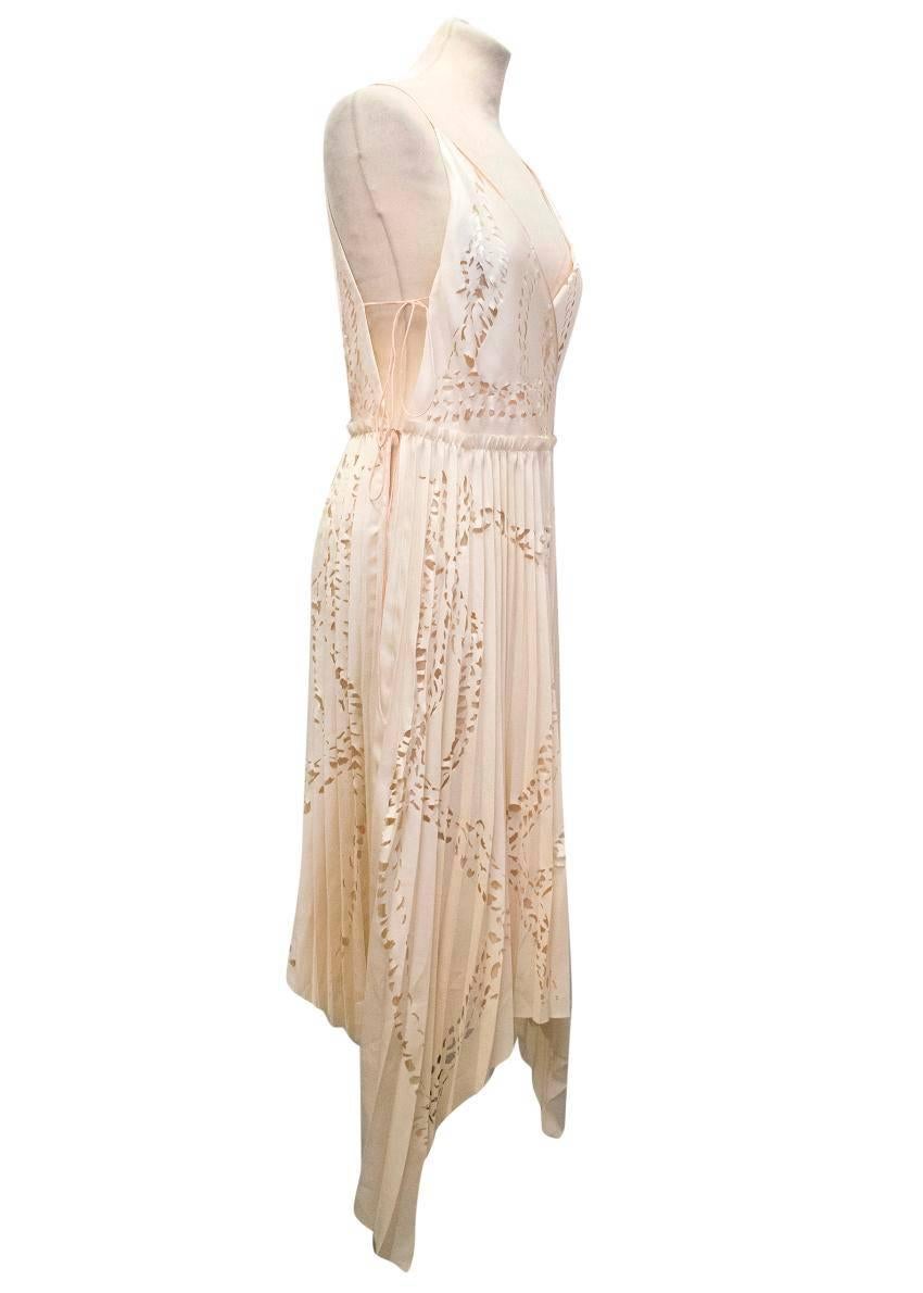 Emilio Pucci matte-satin and silk nude pleated silk dress, with laser cut detailing and ribbon shoulder straps. Loose fitting and lightweight.
 
Condition: 10/10

Size IT: 40
Size UK: 8
Size US: 4

Measurements