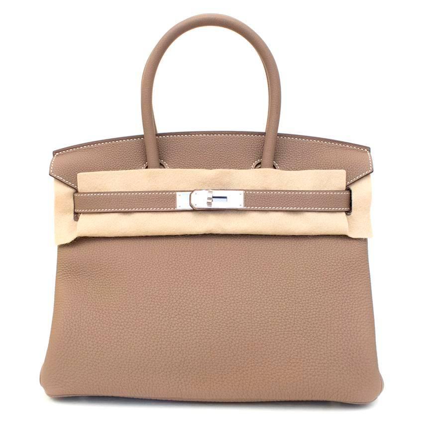 Hermes 30cm Birkin in etoupe togo leather, with palladium hardware.

2017 Date stamp (AHA84Z PN)

Togo leather has an incredibly smooth, matte finish as well as being anti scratch and lightweight.

Approx: Length - 30.5cm Width - 16cm Height -