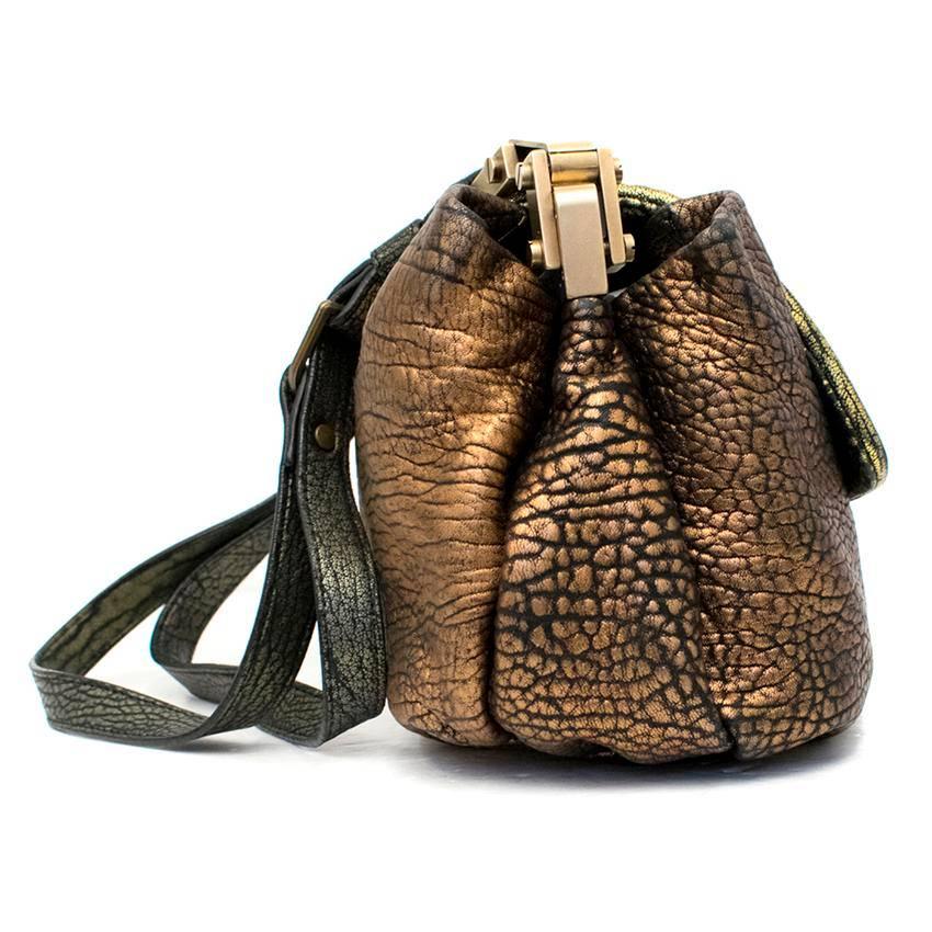 Lanvin gold metallic shoulder bag.

This item features a mid length shoulder strap, two spacious internal sections and zipped pocket.

The bag is closed with a functioning tuck lock.

Conditions Details : Condition:9.5/10

Approx. 
Length:23cm