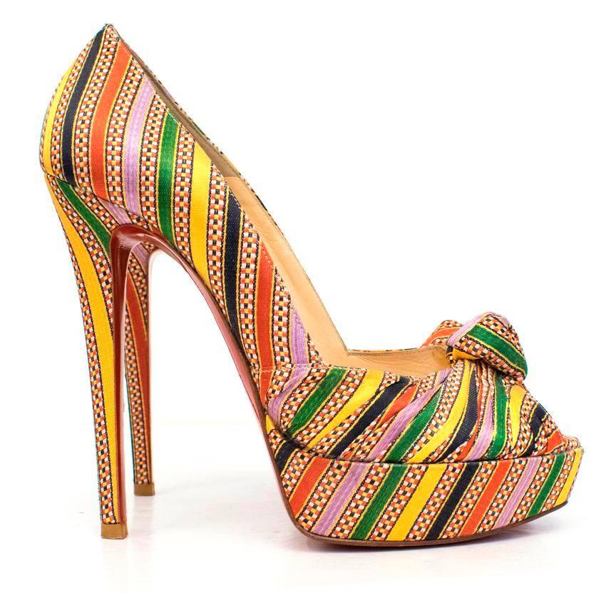 Christian Louboutin Greissimo multi-coloured striped pumps.

This item features a knotted peep toe, with a large stiletto heel and the classic red sole.

Please note, these items are pre-owned and may show signs of being stored even when unworn and