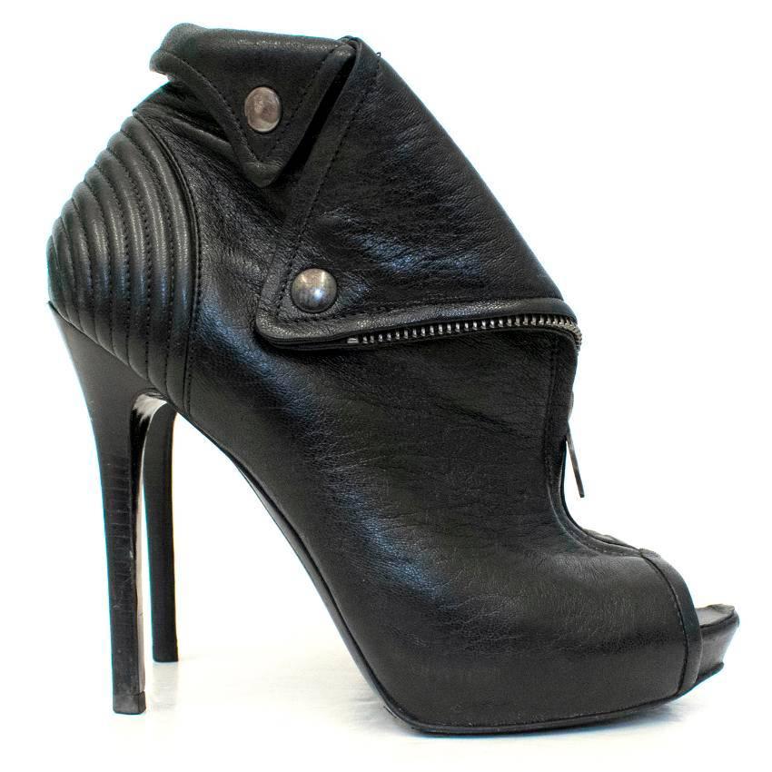 Alexander McQueen black leather ankle boots.

This item features a peep toe, with a stiletto heel and scull zip/button detail.

Please note, these items are pre-owned and may show signs of being stored even when unworn and unused. 
Approx.