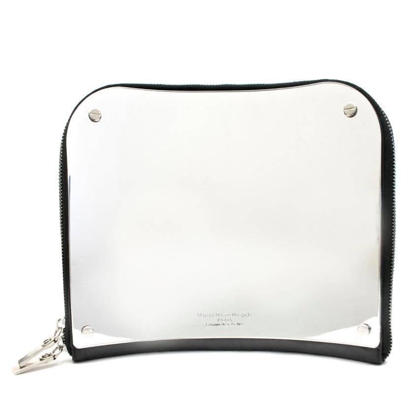 Maison Martin Margiela Defile concave mirror clutch. 

Features expandable front pocket with two compartments and two internal suede lined pockets. Two-way zip fastening at top. 

Approx. 
Height: 22 Cm 
Width: 25.5 Cm 
Depth: 3 Cm
