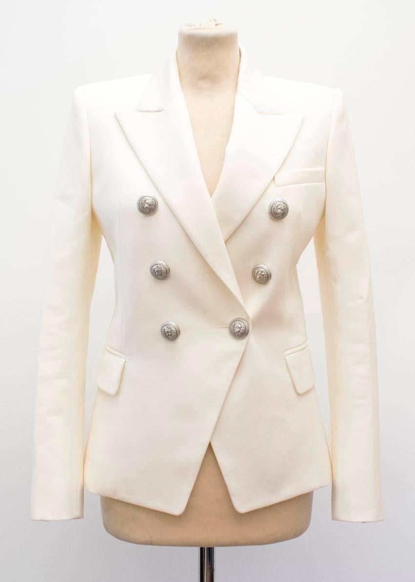 Balmain cream blazer. 

Double-breasted blazer with large silver buttons. 

This item belongs to Caroline Stanbury of 'Ladies of London'. 

Condition - 10/10 

Approx. 
Sleeve length: 60 cm
Length: 62 cm
Bust: 44 cm

US size 4