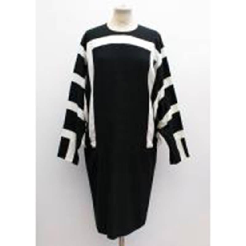 Chloe black and white crew neck long sleeve dress. Batwing sleeves with black and white pattern, plain black on bottom half of dress. Zipper enclosure on the back of the dress. 

Size: L, EU42, US10
Measurements	: Approx. Shoulder: 48cm Sleeve