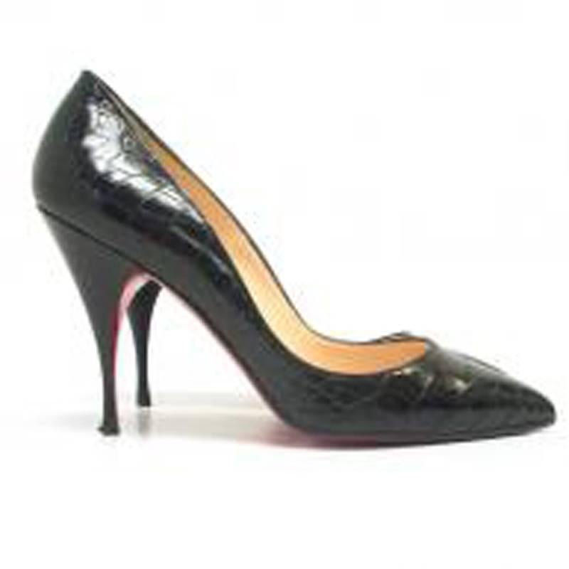 Christian Laboutin black crocodile pumps with signature Louboutin red soles in a pointed toe, stiletto heel style.

Size: US 7
Measurements: Approx. Width 7.5cm Heel Height 10.5cm
Condition: 9.5/10. Minor wear to soles.

* Please note, these items