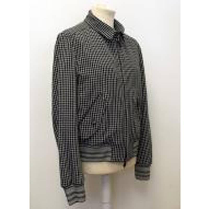 Tom Ford monochrome check zip jacket in a collared bomber-style in an all-over geometric print featuring two front flap pockets with ribbed cuffs and waistline.

Size: XL
Measurements: Approx. Sleeve: 69cm Cuff: 10.5cm Chest: 60cm Shoulder: 49cm