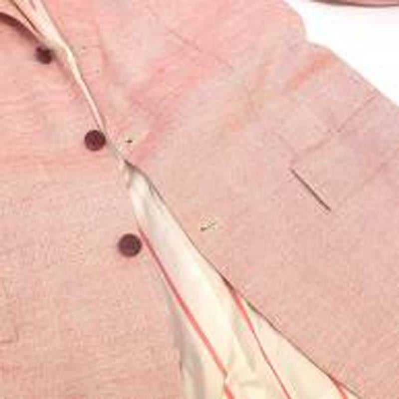 Kiton pink woven blazer in a single-breasted style with notch lapels, three pockets and three dark red buttons to fasten. Lined in striped pink and cream 

Size: M
Measurements: Approx. Shoulder - 45cm Chest - 53cm Sleeve - 67.5cm Length -