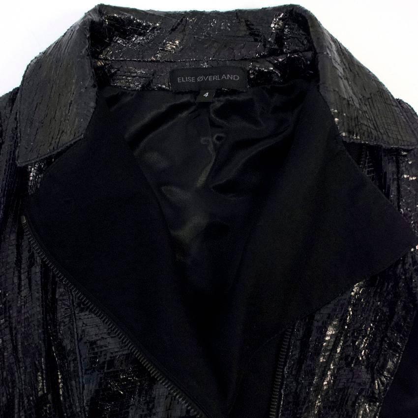 Elise Overland black snakeskin jacket with functioning zip for closure. The jacket also features zipped cuffs, with two pockets.

Size: US 4
Measurements: Approx. Length: 51cm Sleeve: 58cm
Condition: 9.5/10

* Please note, these items are pre-owned