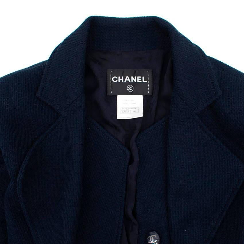 Chanel navy blue coat in a double-layer style with notch lapels, three front button closure with signature Chanel logo. Lined in floral silk. 

Size: L. No size label, please refer to measurements.
Measurements: Approx. Shoulder: 44cm Sleeve: 61cm