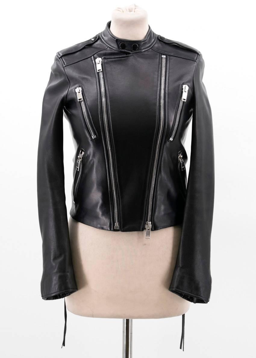 Saint Laurent black leather jacket. Soft leather. Four zipper pockets on the front with silver detail. Silver zipper on each cuff. Two tassels on the back lining. Two button closure on the neck. 

Condition: 9.5/10 

Very minor storage marks.