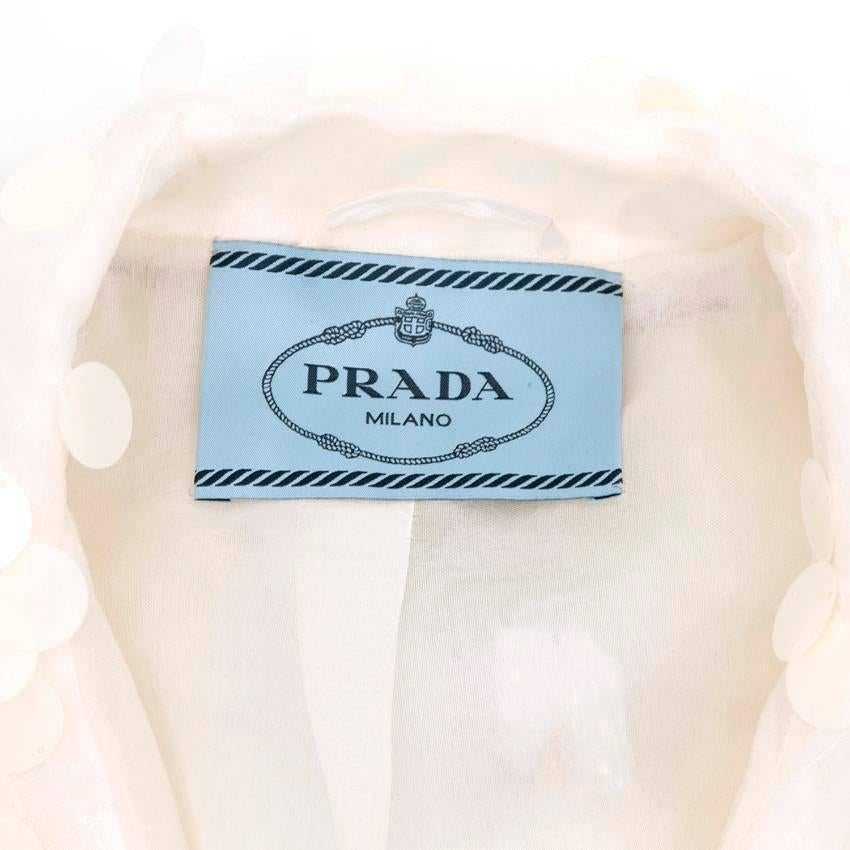 Prada white sequin jacket. Runway item. 
Thin silk jacket featuring white sequins and green rhinestone detailing. Made in Italy. 

RRP APPROXIMATELY £4,850. 

Conditions Details : 

Condition - 9.5/10 

Please note, these items are pre-owned and may