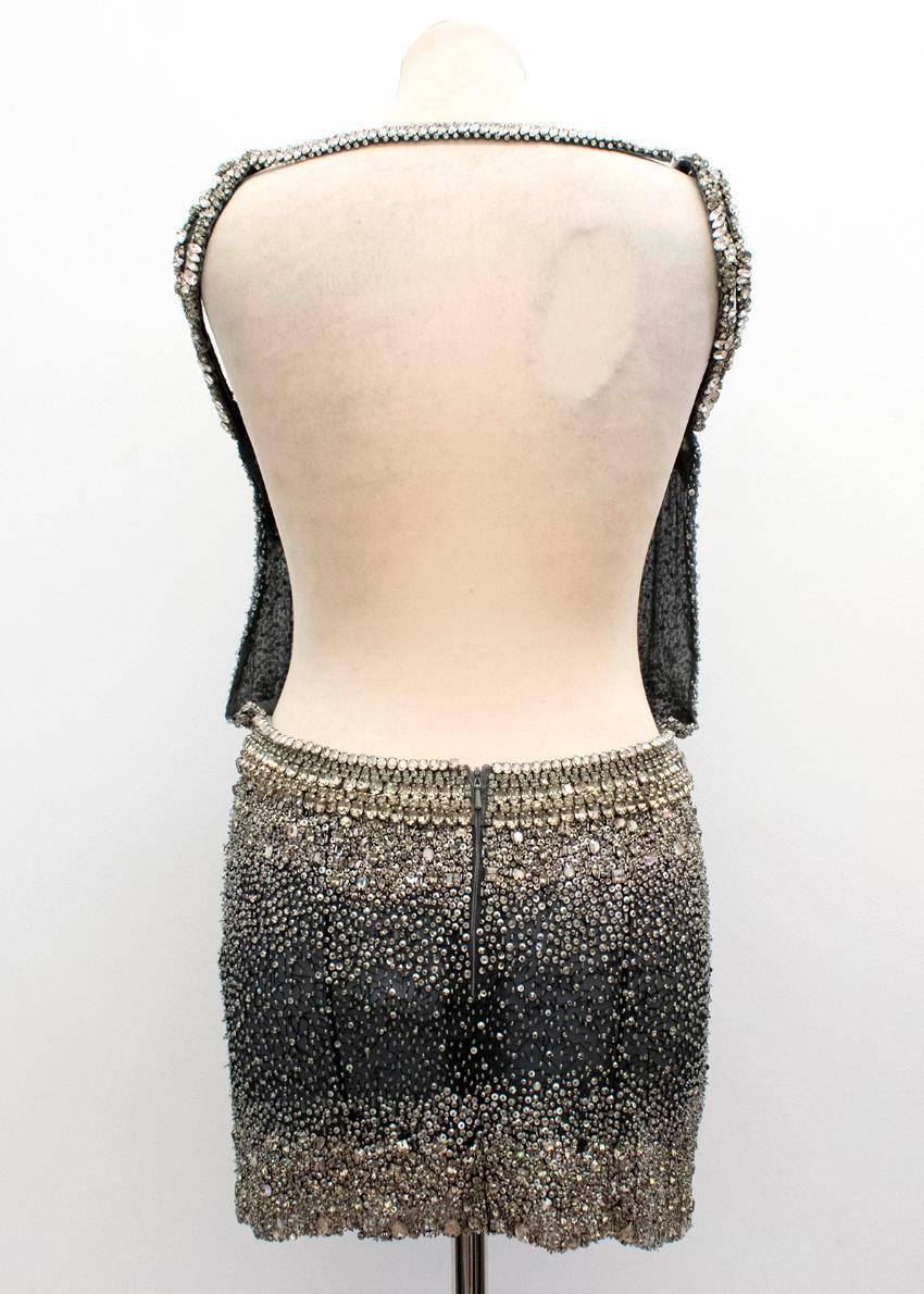 Ralph & Russo sequined dress. 

Open back mini dress with lace and sequin detailing. Made in the UK. 

Conditions Details : 

Condition - 9/10. 

Please note, these items are pre-owned and may show signs of being stored even when unworn and unused.