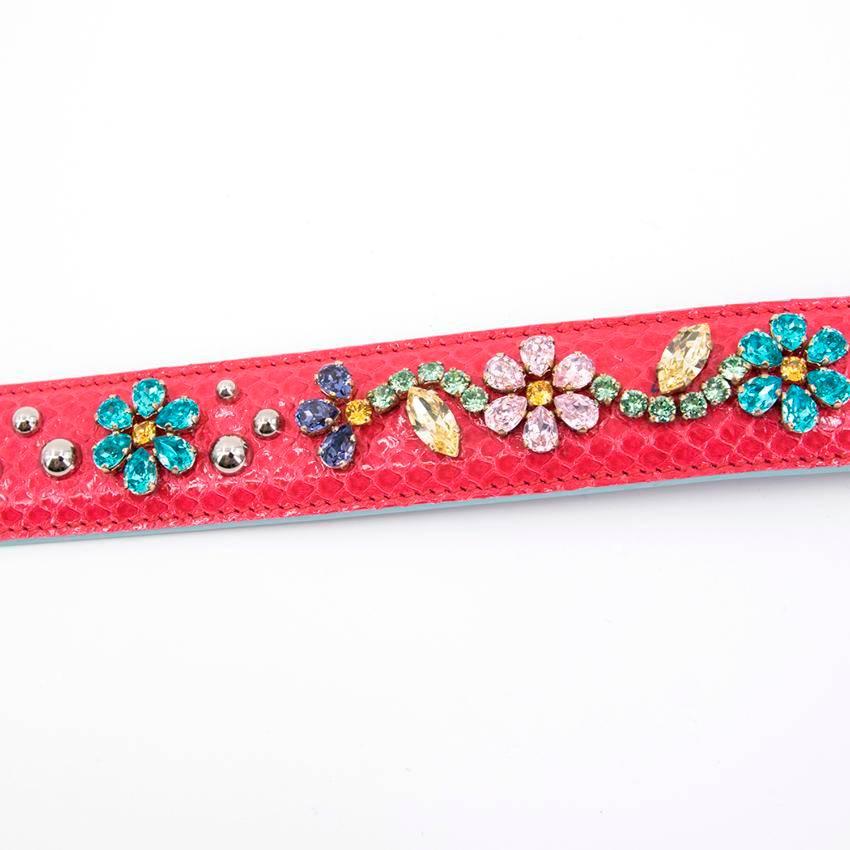 Dolce and Gabbana pink embellished handbag strap. Features blue, green, pink, yellow and purple stones with silver stud applique. Lined in purple Dauphine leather with gold tone hardware. 

Condition - 10/10 

Approx. 
Length - 57cm 
Width - 3.5cm