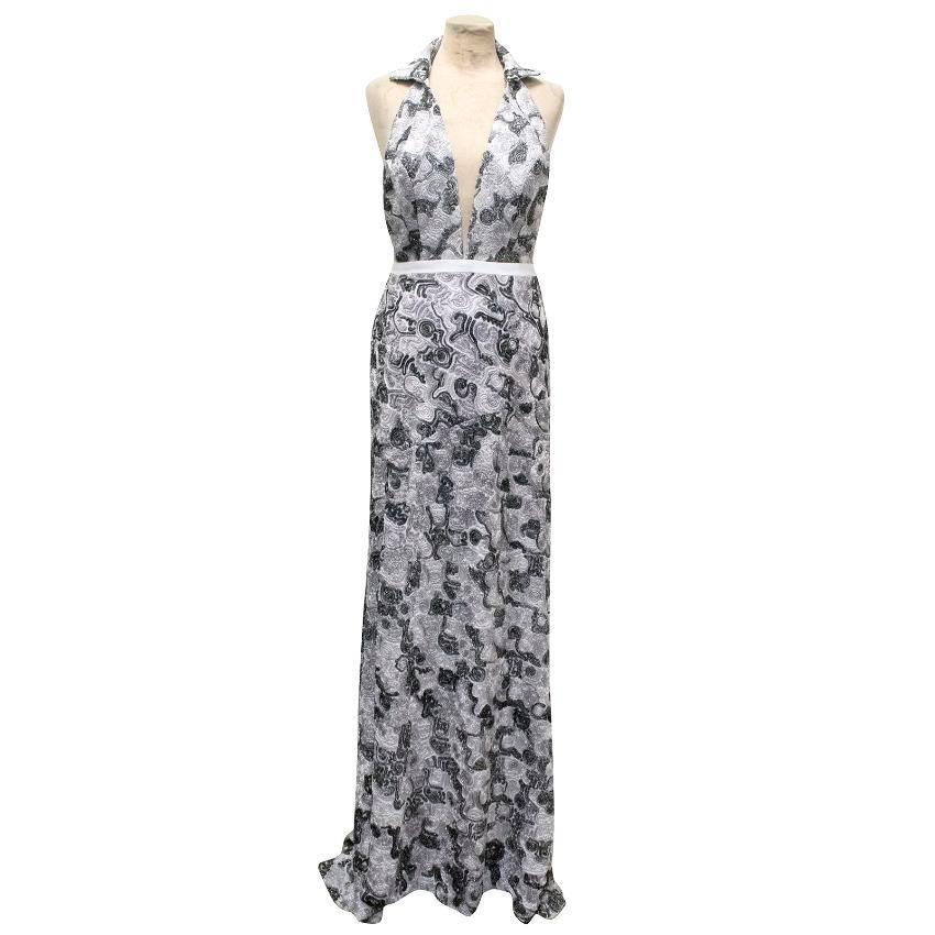 Maison Anoufa couture silver and grey embroidered halter neck backless gown with a high slit and a short train. Features a white leather insert around the waist.
Fastens at the back with a concealed zip. 

THERE IS NO SIZE LABEL, HOWEVER, BASED ON