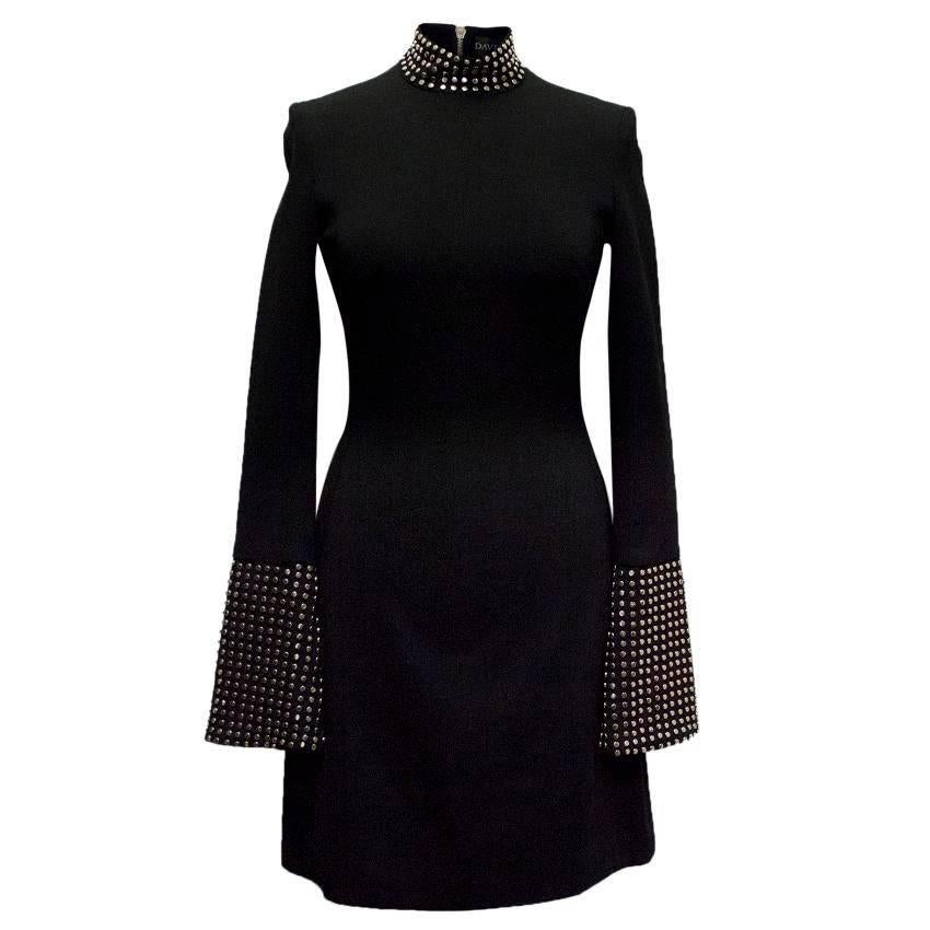 David Koma black studded high-neck dress with flared sleeves and an a-line knee-length fit. Featuring studded detail at the neckline and cuffs.

Size: US 4
Measurements: Approx. Shoulder - 36cm Waist - 33cm Sleeve - 68cm Length - 95cm
Condition: