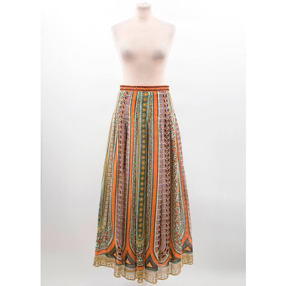 Valentino maxi tribal print skirt in a full, flared style with a multicoloured all-over print in a fitted high-waist style.

Size: US 4
Measurements: Approx. Waist: 36cm Length: 101cm
Condition: 10/10

* Please note, these items are pre-owned and