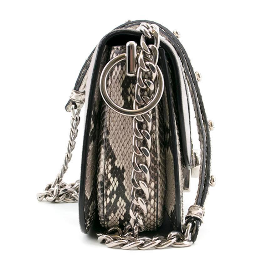 Prada Arcade Python & Leather Flap Bag. 

Features adjustable silver chain strap, main inner compartment with zip pocket, inner slip compartment, and silver clasp closure. 

Conditions Details : Condition - 9/10. Some discoloration of grey suede