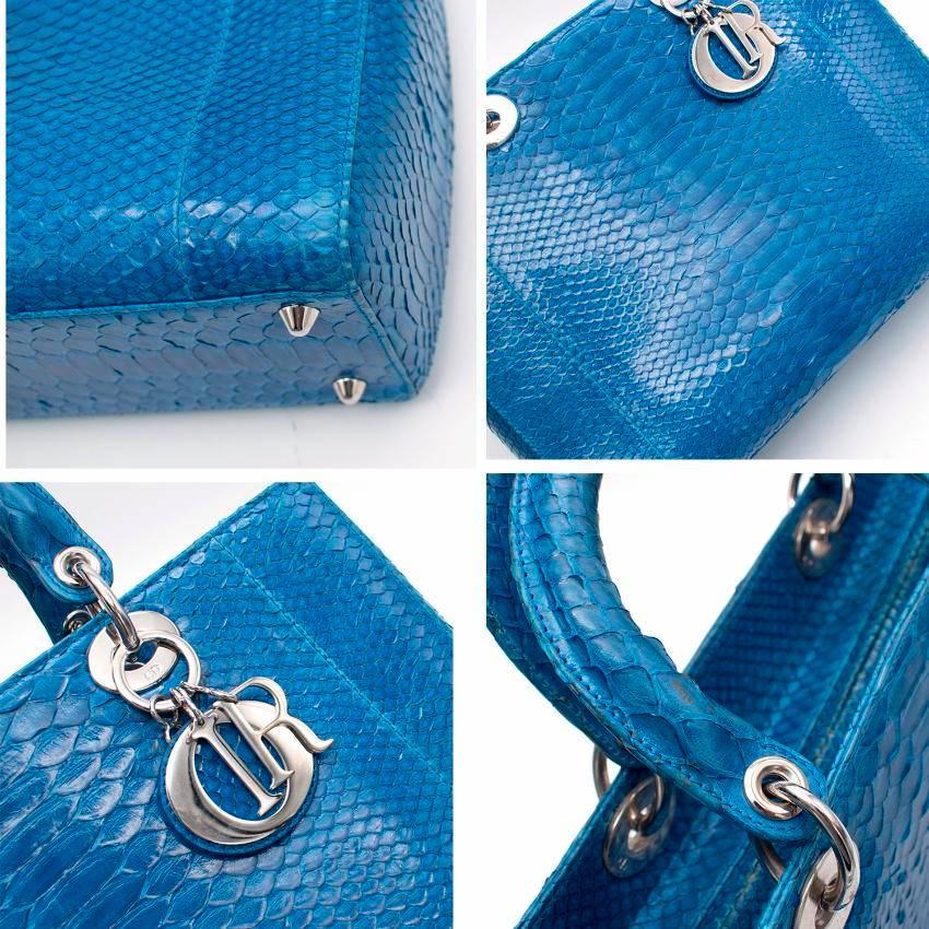 Lady Dior electric blue python tote bag. 
Made in Italy. 
Limited edition. 

Features short dual handles, sleek Dior charms, protective base studs and silver-tone hardware accents. 
Includes a small zipped interior pocket.
Includes zip closure.