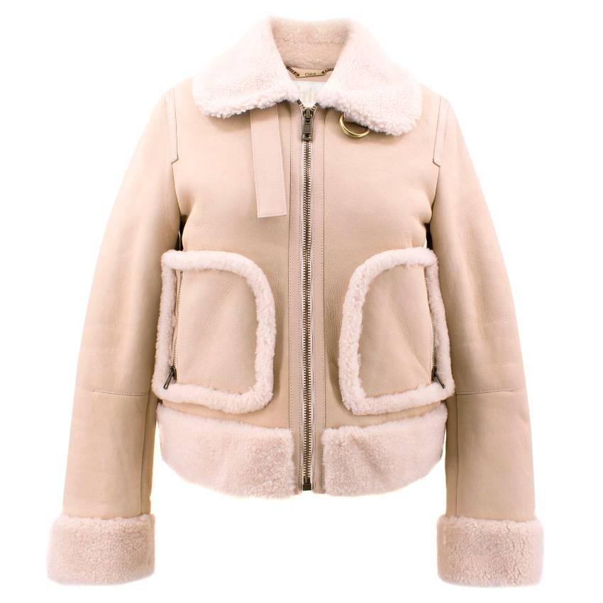 Chloe Leather and Shearling Coat.

Condition: 9.5/10, in excellent condition. Never worn without tags. 

Leather aviator jacket featuring a shearling lining with a shearling collar, cuffs, hem and trim . Two side zipped pockets and front zip
