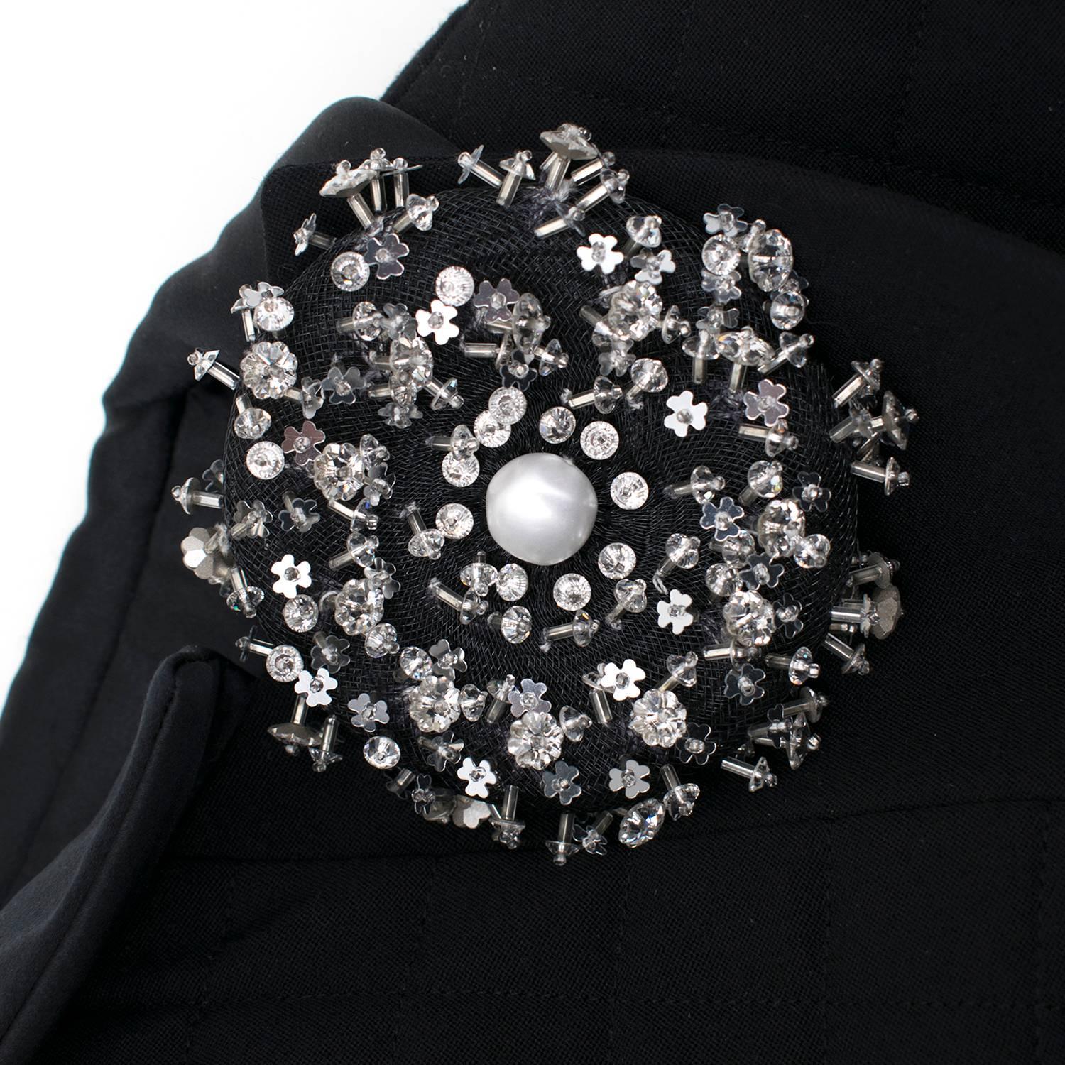 Chanel Jacket and skirt suit with embellished brooch 
Vertical button fastening along Jacket
Brooch covered with silver embellishment.

Fabric: Laine Wool, Soie Silk. 

Size: M. 

Jacket:
Shoulders- 9cm
Chest- 51 cm
Sleeves- 55cm
Length-