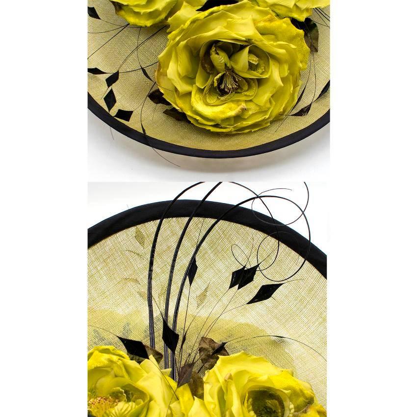 Siggi London Bespoke  floral headpiece. 

Features a large brim and decorated in lime green flowers and feathers. 

Fabric: Natural fibres/Velvet/Feathers. 

Perfect condition: 10/10. Never worn without tags. 

Accompanied by box. 

Approx