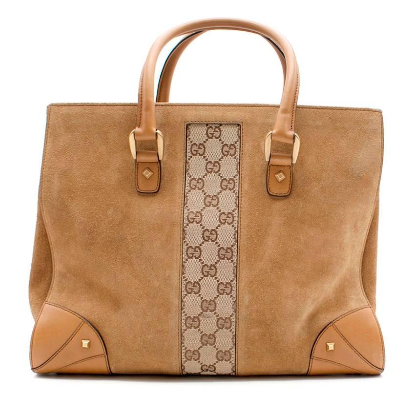Gucci Brown Suede/Monogram Bag.

Gucci brown suede with Gucci monogram strip bag.inside pockets. Includes Gucci dust bag.

Fabric: Suede. 

Condition: 9.5/10. Never worn without tags. 

Approx:
Handle/ Strap Drop- 19cm
Width- 33cm
Length -