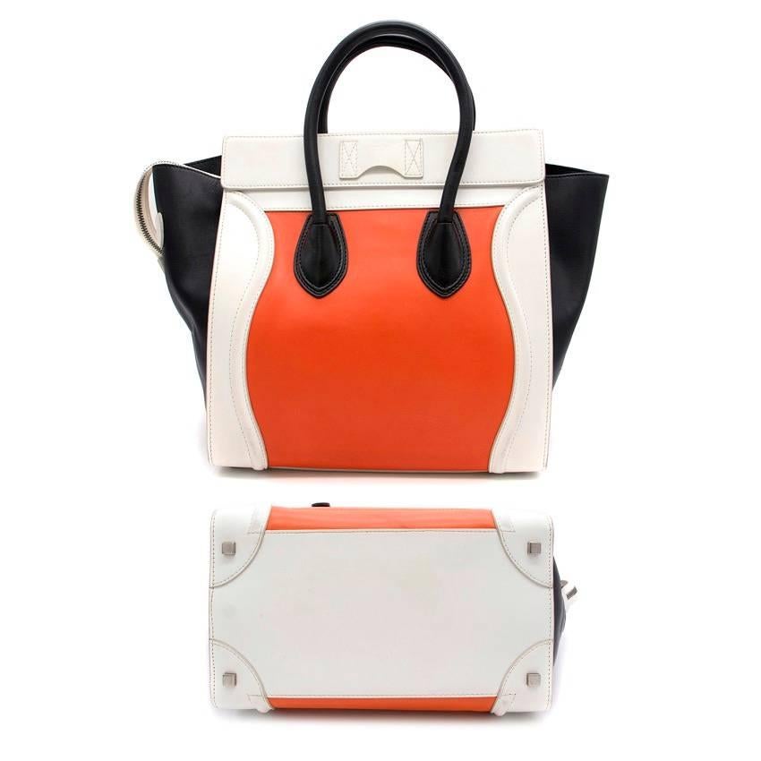 

Celine tricolour hand bag in calfskin with zipper closure, zipped pocket on front and protective studs on base.

Fabrics: Leather.

Condition: 9.0/10. Hardly ever worn/Used. Minor signs of wear but still in great condition. Very minor hair line