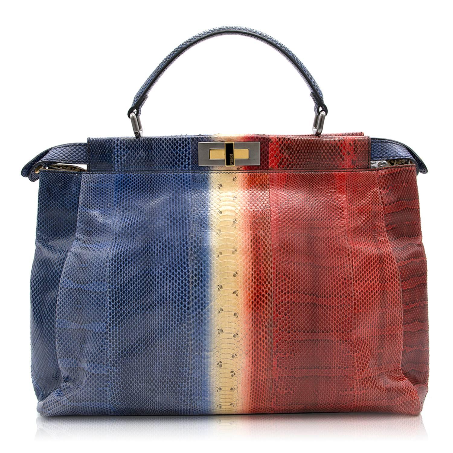 Fendi multi- coloured tote bag. 

Composed of three interior compartments and zipped pocket within interior. 
Fastened with turn lock and magnetic fastener. 

Fabric: Python/Palladium-finish metalware.

Size One Size/Large 

Approx: 
Strap drop-12cm