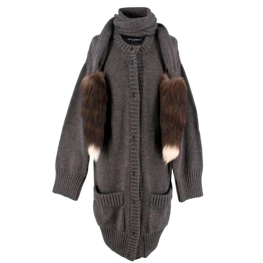 Dolce & Gabbana Grey Fox Cardigan

-Attached Neck wrap with Silver Fox tails to the end
-Eight snap buttons to the front
-Two front pockets

Please note, these items are pre-owned and may show signs of being stored even when unworn and unused. This