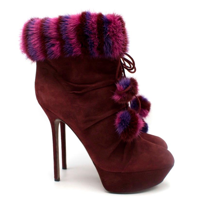 Sergio Rossi Burgundy Mink Trim Platform Booties

-Platform booties with bows and pom poms
-Twist and ruching detail along centre of boots
-Striped mink fur cuffs and pom poms

Please note, these items are pre-owned and may show signs of being