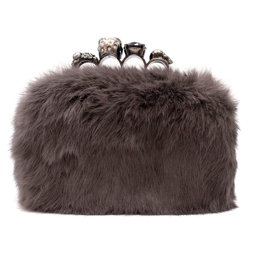 Alexander McQueen Mink Fur Knuckle Duster Clutch

- Grey mink fur outer
- Black leather lining
- Silver-tone hardware
- Skull, pearl and crystal embellished knuckle duster handle to the top

Please note, these items are pre-owned and may show some
