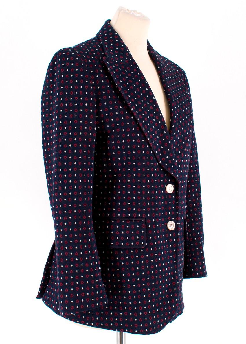 Gucci Navy Patterned Blazer 

-Navy fabric with red hearts and ivory dots
-Collared
-Two button closure to the front 
-Two flap pockets to the front
-Two slits to the back 
-Four buttons to each cuff 
-One illusion pocket to the chest
-Two interior