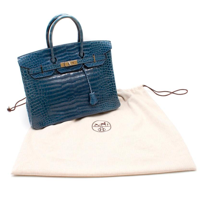 Hermes Blue Roy Porosus Crocodile 35cm Birkin Bag

- Reference: 2
- Serial number: [I]
- Age (Circa): 2005
- Palladium hardware 
- Two rolled leather top handles
- Interior zipped pocket and pouch compartment 
- Rain mac and clochette