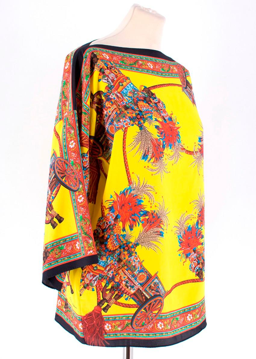 Dolce & Gabbana Yellow Abstract Silk Blouse Size XXS

-Yellow/Red/Blue/Black abstract pattern throughout 
-Black outlining to neckline, cuffs, and waistline 
-Loose fit

Please note, these items are pre-owned and may show some signs of storage, even