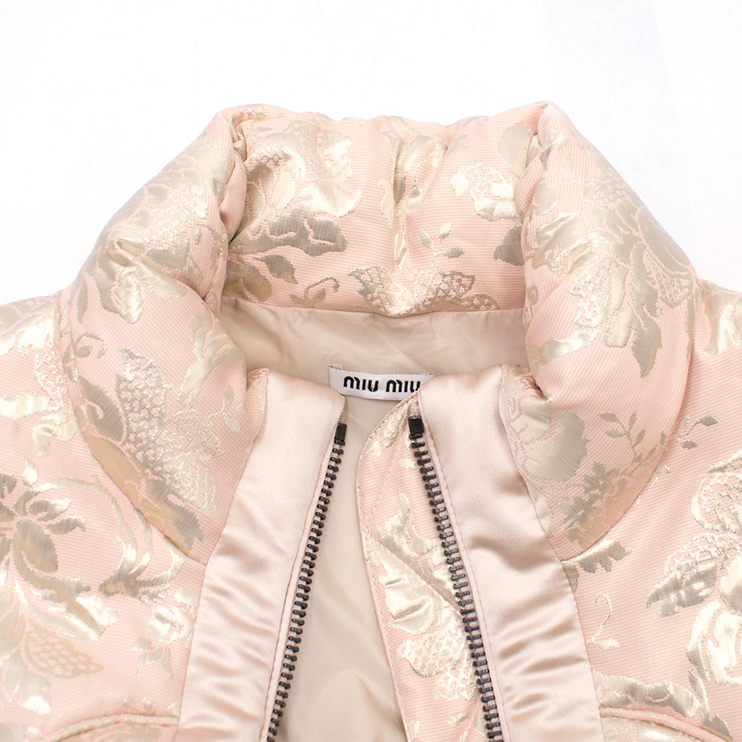 Miu Miu Pink Cropped Floral Jacket

-Pink puffer jacket with gold floral pattern
- Acetate blend
-Cropped
-Quilted
-Two front pockets
-Elasticated cuffs
-Gun metal toned zip
-Waterproof interior belt with poppers

Sizing:
Italian size