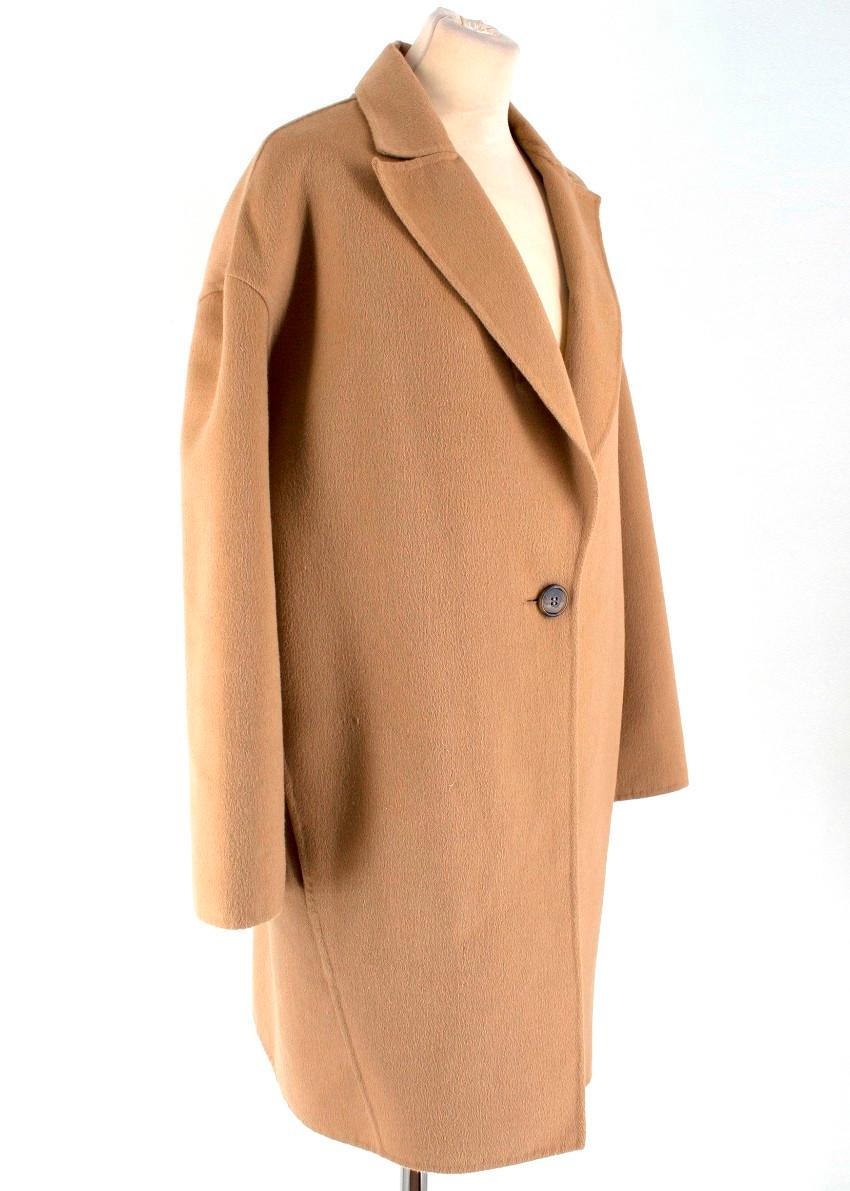 Caroline Herrera Icon Collection Single-button Dress Coat

- Soft camel angora and wool blend over coat
- One button fastening
- Spare button and original tags 
- Relaxed fit
- Oversized silhouette
- Dropped shoulders
- Notched lapel
- Long