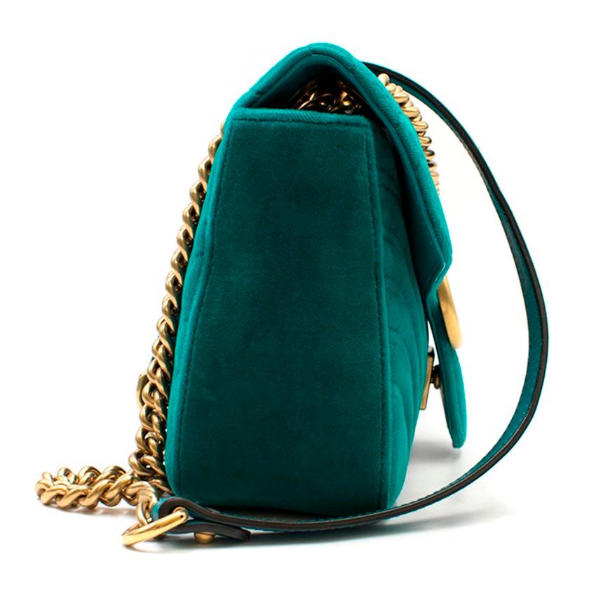 Gucci Small Turquoise GG Marmont Velvet Bag

-Turquoise quilted velvet shoulder bag
-Gold toned hardware
-Sliding chain strap
-Spring closure clasp
-One main interior pocket with one further zipped pocket
-Chevron quilting with heart detail on the