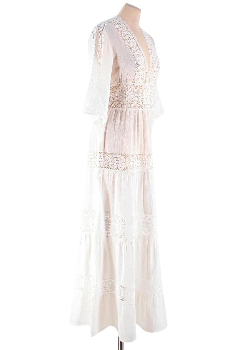 Vilshenko Ivory Crochet Floral Dress

-Ivory dress with sheer white floral crochet panels 
-Maxi dress with 3/4 length sleeves
-V neck
-Back zip closure
-Ruching under the bust
- Unlined with see through crochet panels

Please note, these items are