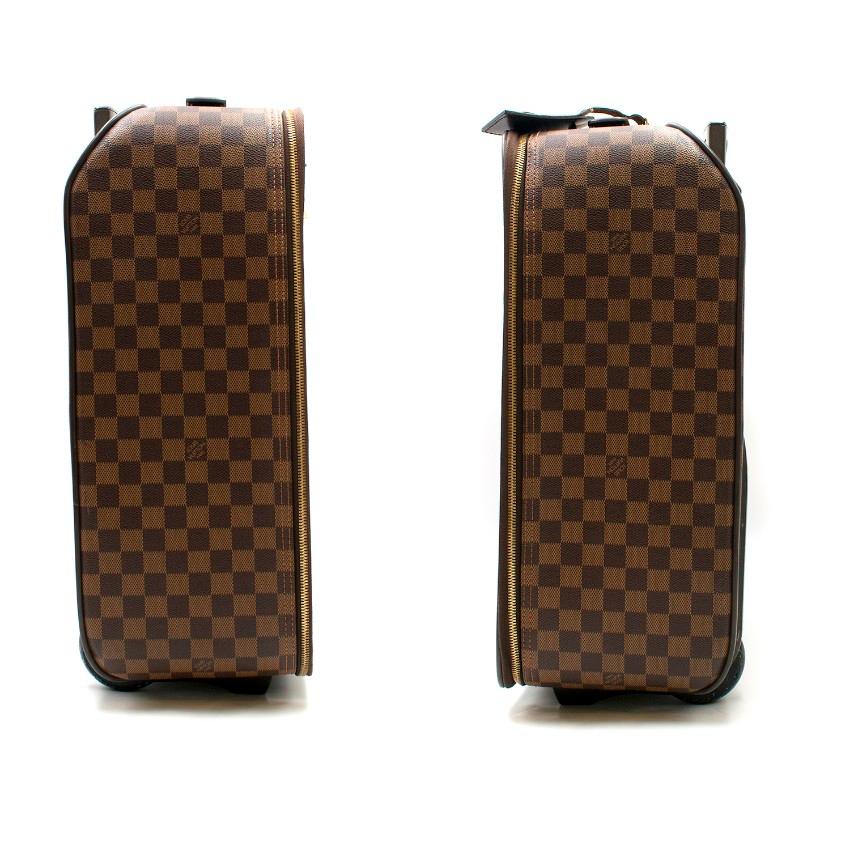 Louis Vuitton Brown Damier Ebene Pegase 55 Rolling Luggage

-Brown damier ebene hand luggage suitcase
-Gold toned zips
-Features top handle and telescopic handle
-Front zipped pocket
-Features name tag on handle
-One main interior pocket with three