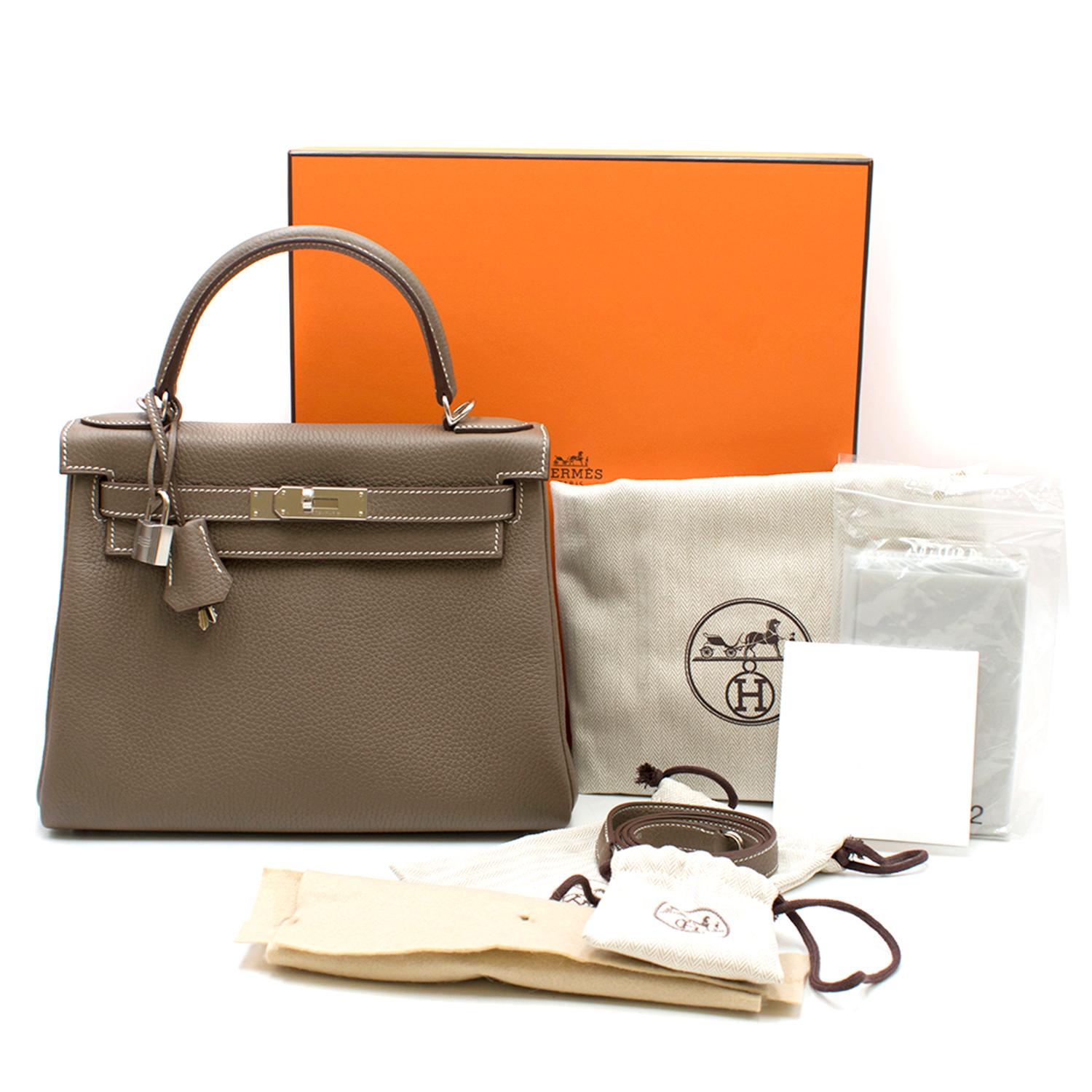Hermes Clemence Leather Etoupe 28cm Kelly Bag

- Circa: 2018
- Taupe clemence leather
- Twist-lock closure on front flap
- One rolled leather handle
- Inside zip compartment
- Inside pouch compartments
- Silver palladium hardware
- Contrast