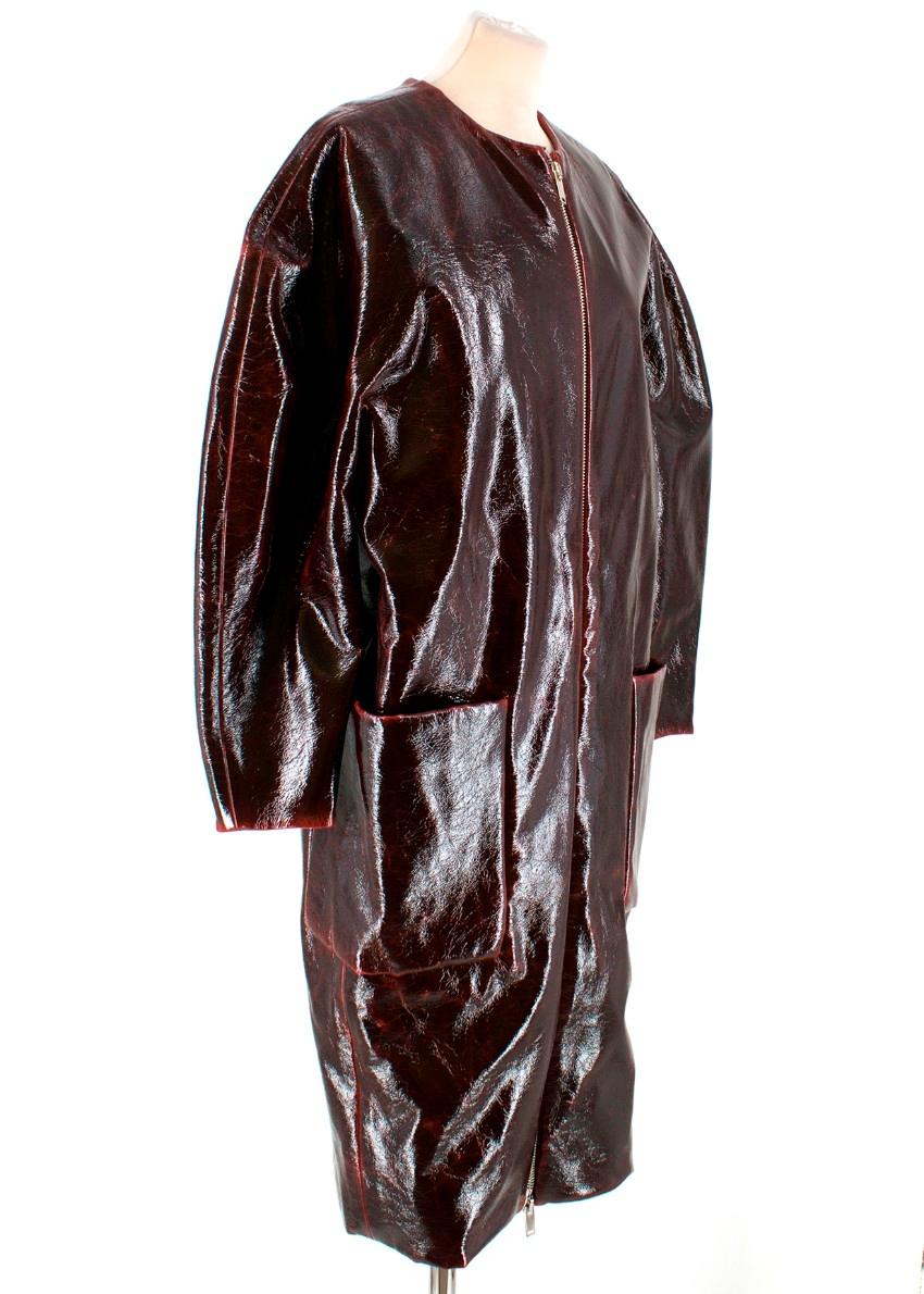 Zaid Affas Burgundy Laminated Wool Cocoon Coat

-Burgundy patent wool coat
-Silver tone zip closure
-Two front pockets
-Scoop neckline

Please note, these items are pre-owned and may show signs of being stored even when unworn and unused. This is