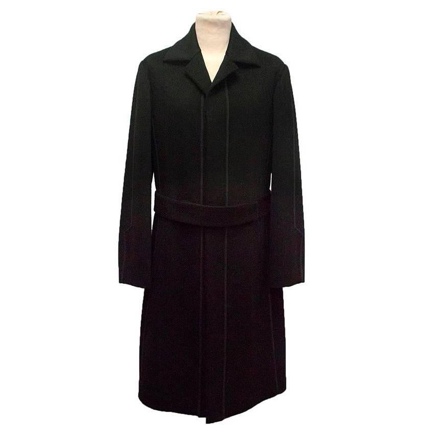 Narciso Rodriguez black cashmere trench coat with a pointed collar and piping detail. Belted at the waist with concealed button closure, the coat is soft to the touch, unlined and medium weight with a classic fit. Made in the USA. Size EU