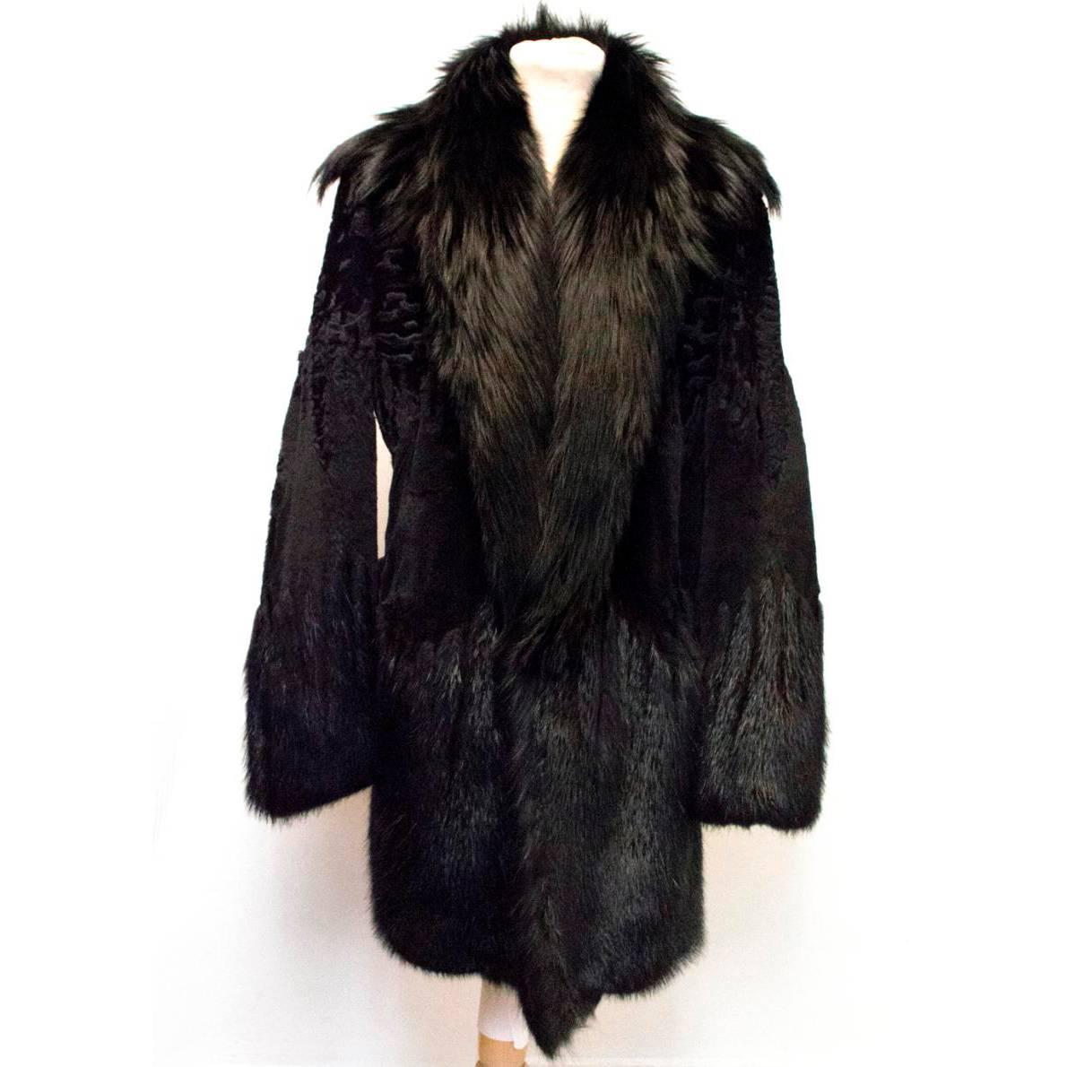 Gucci black fur coat, believed to be beaver, rabbit and Mongolian sheared lamb. Fully lined in a supple leather with shawl lapels and a single snap-hook fastening at the front. The coat is soft to the touch and heavy-weight. Size IT 50. Made in