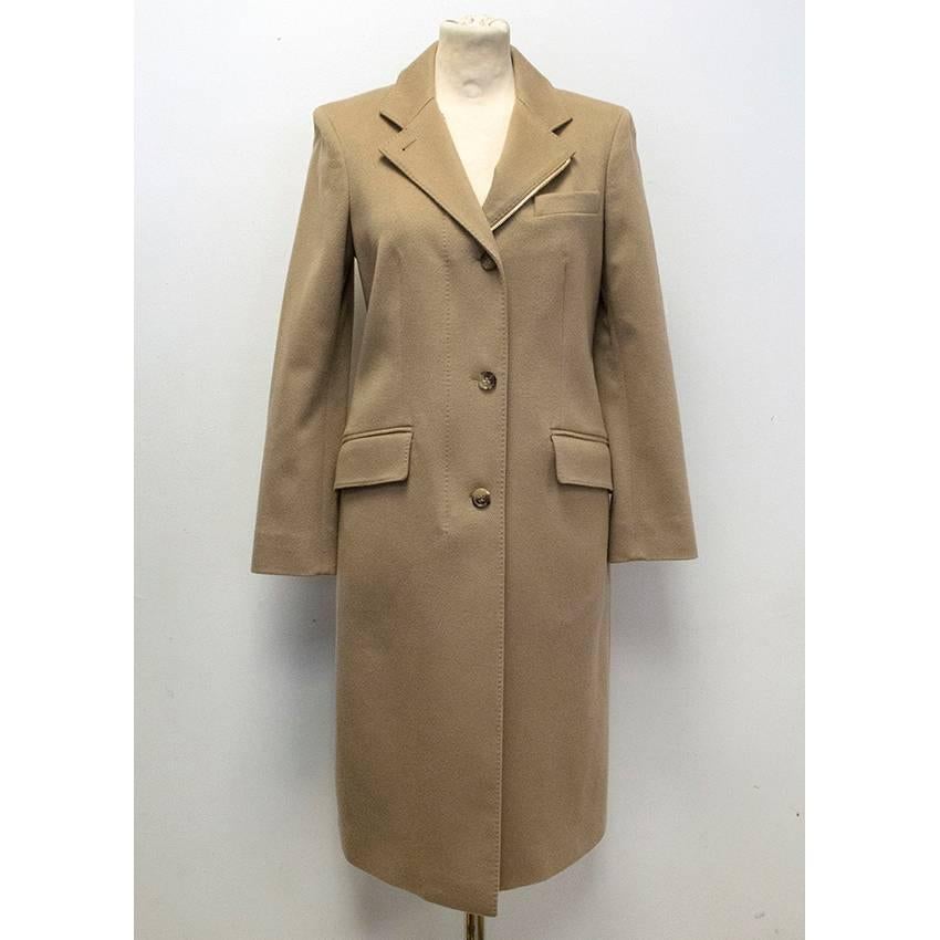 Loro Piana long line cashmere camel coloured coat with notch lapels, gold zipper hardware, four button closure, and two flap pockets. The coat is medium weight and fully lined with padded shoulders. Size IT 40, UK 8, US 4. 

Made in Italy. 100%
