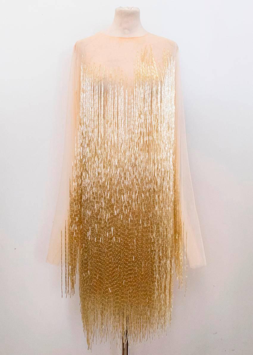 Charbel Zoe nude tulle dress embellished with gold beading with a fringed hem. The dress is long sleeved and heavy weight in a flapper style with a crew neckline and zipper closure at the back. US 8-10, UK 12-14.

Please kindly note that there are